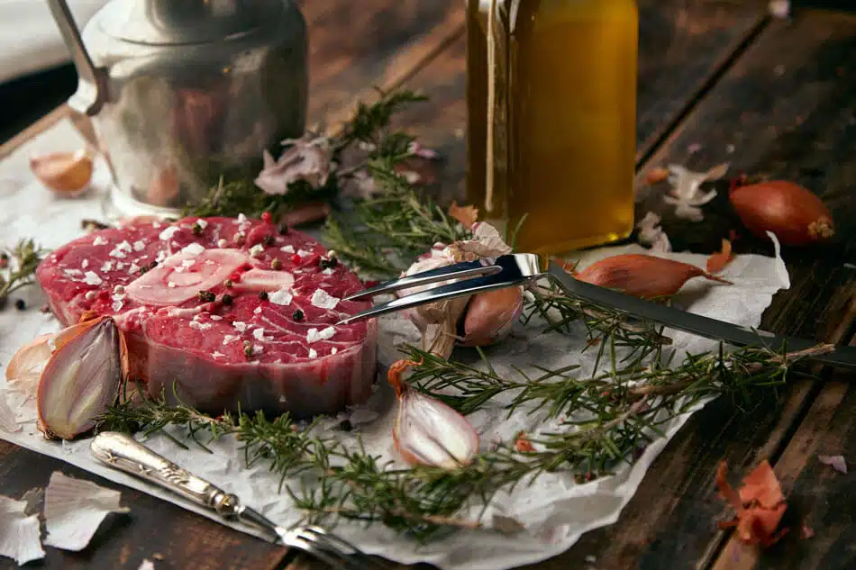 food-set-onions-romero-meat-steak-salt-pepper-garlic-olive-oil-fork